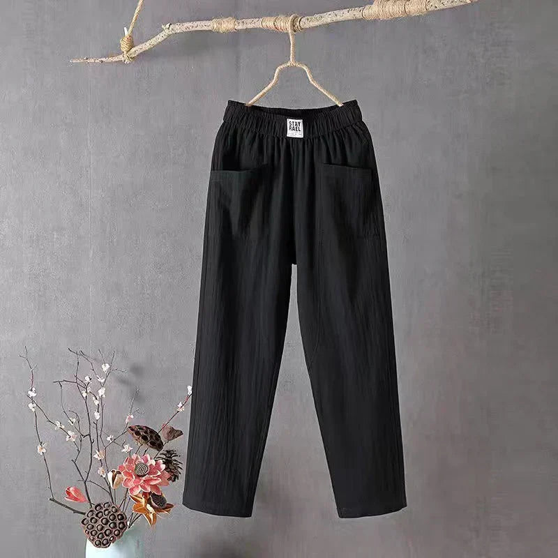Straight-cut trousers with an elastic waistband and a simple design